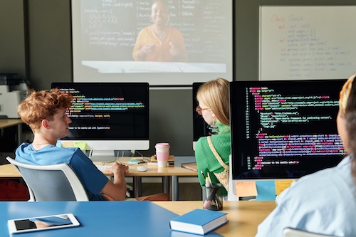 Team of Zoho Partner Developers at Rhino Group consulting writing code in the shared office space known as the pit